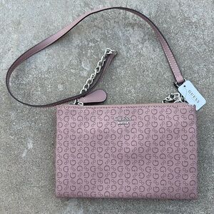 Guess brand mauve shoulder purse with silver chain.